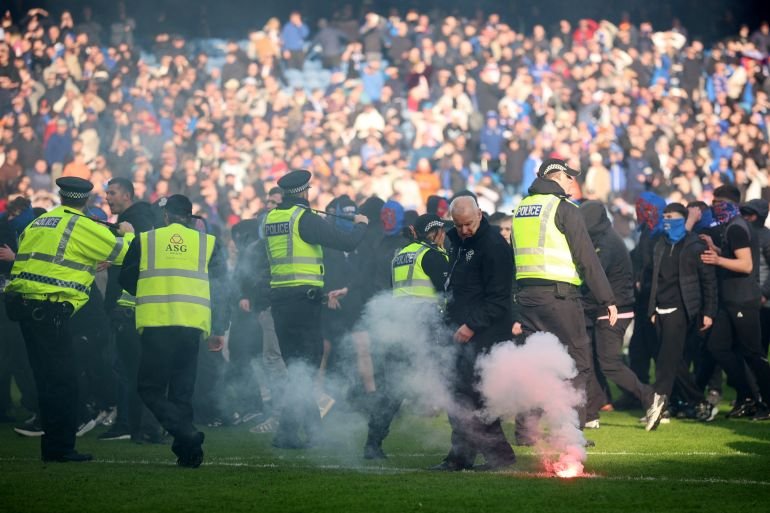 Rangers vs Celtic turns ugly as fans clash on pitch after Scottish Cup tie