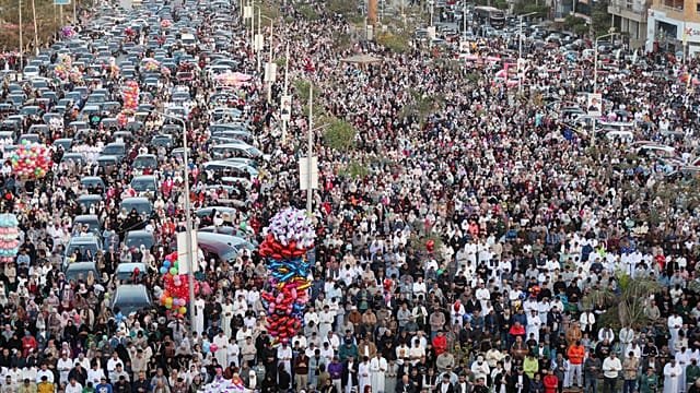 Egyptians attend prayers at a mosque to mark Eid celebrations