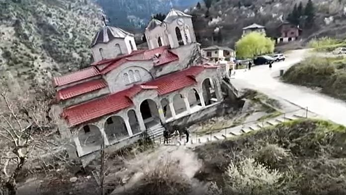 Tourists test balance inside tilted church in Greece’s Ropoto