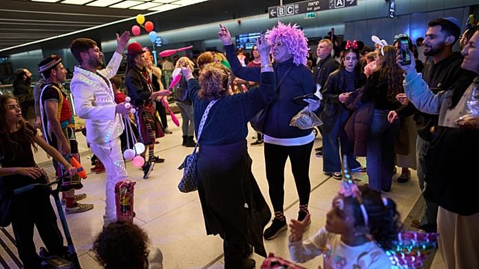 Israelis celebrate Purim in bomb shelter amid missile alerts