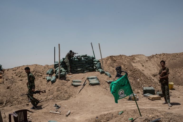 Strikes kill two PMF fighters in northern Iraq amid wider war, group says