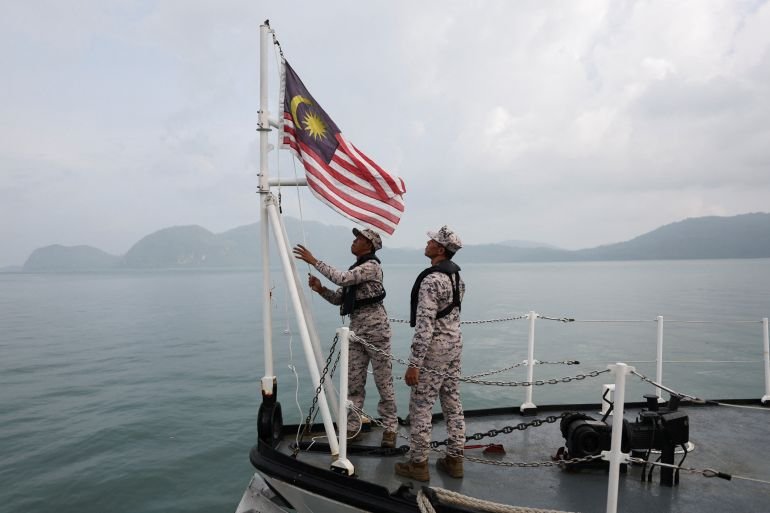 Malaysia rescues 23 migrants after boat capsizes, 14 still missing