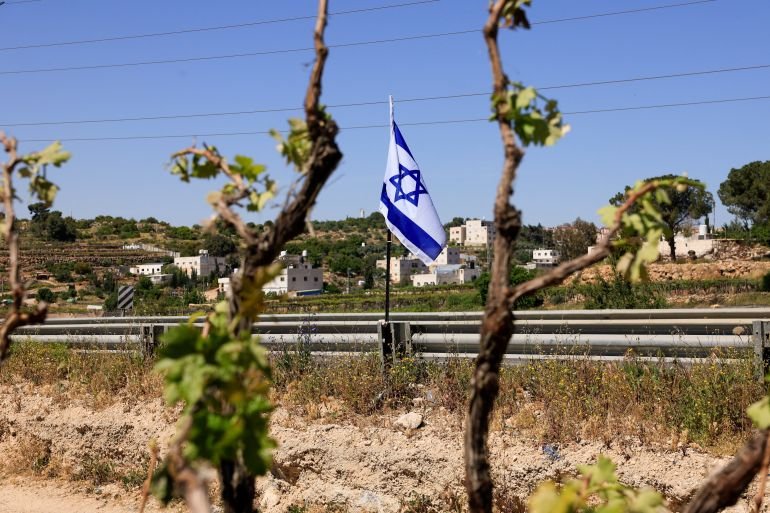 Israeli settlers force Palestinian family to exhume and rebury their father