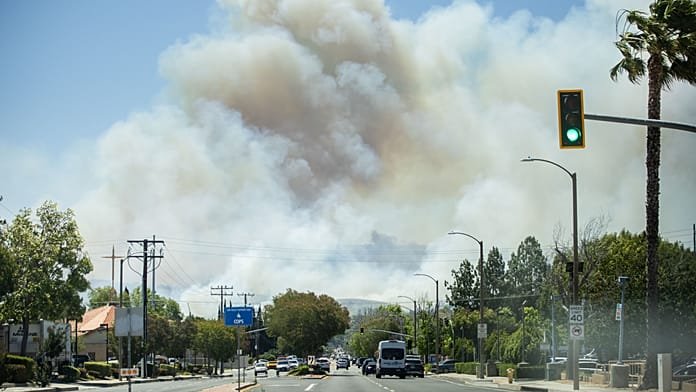 Fast-moving wildfire spreads through Southern California hills